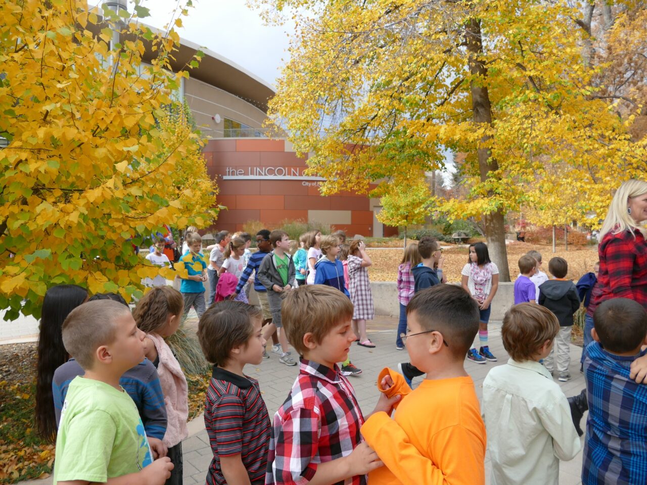 Kids standing outside The Lincoln center waiting for a show.