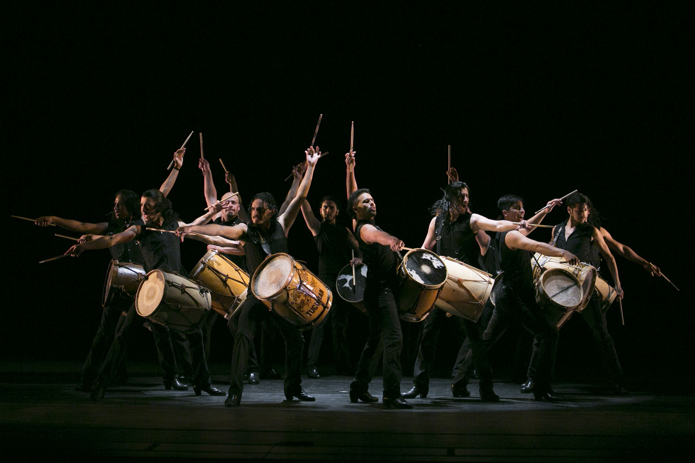 Members of Chelambo beating their drums passionately.