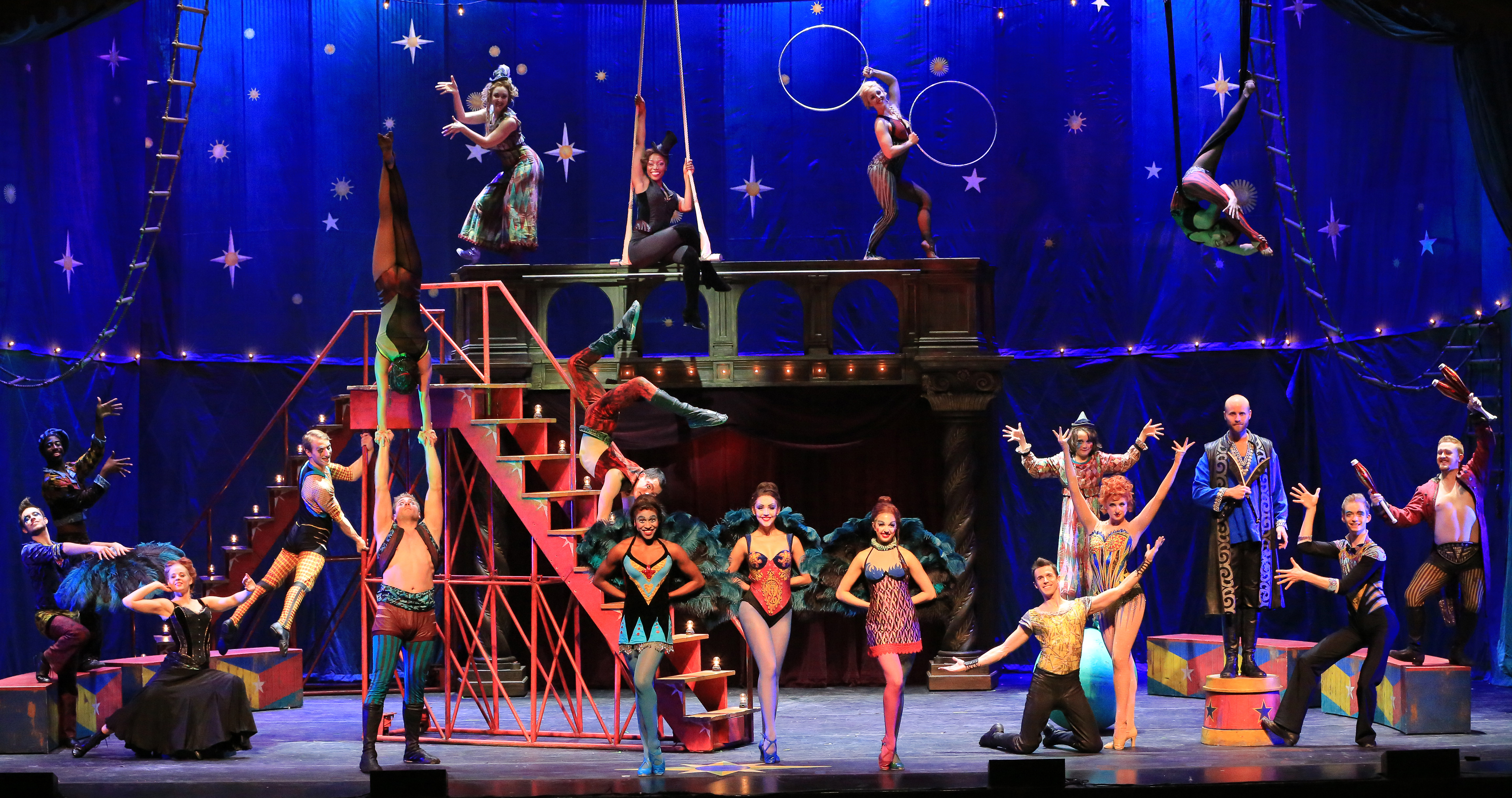 A wide shot of the circus performers from Pippin.