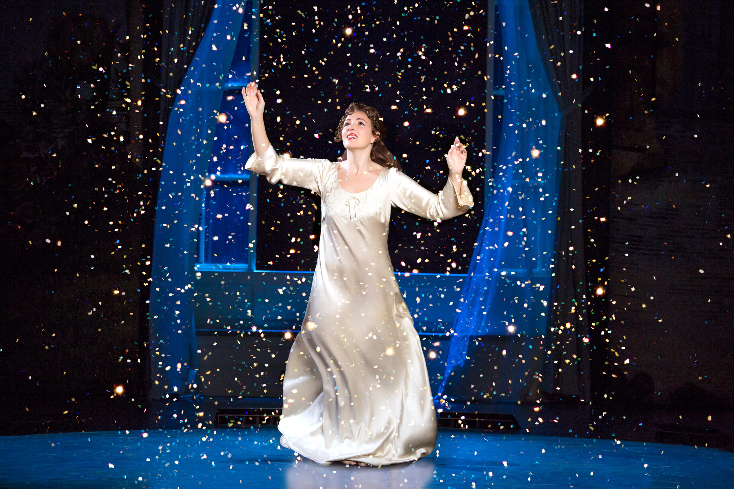 Wendy dancing in her nightgown admist a tornado of glitter.