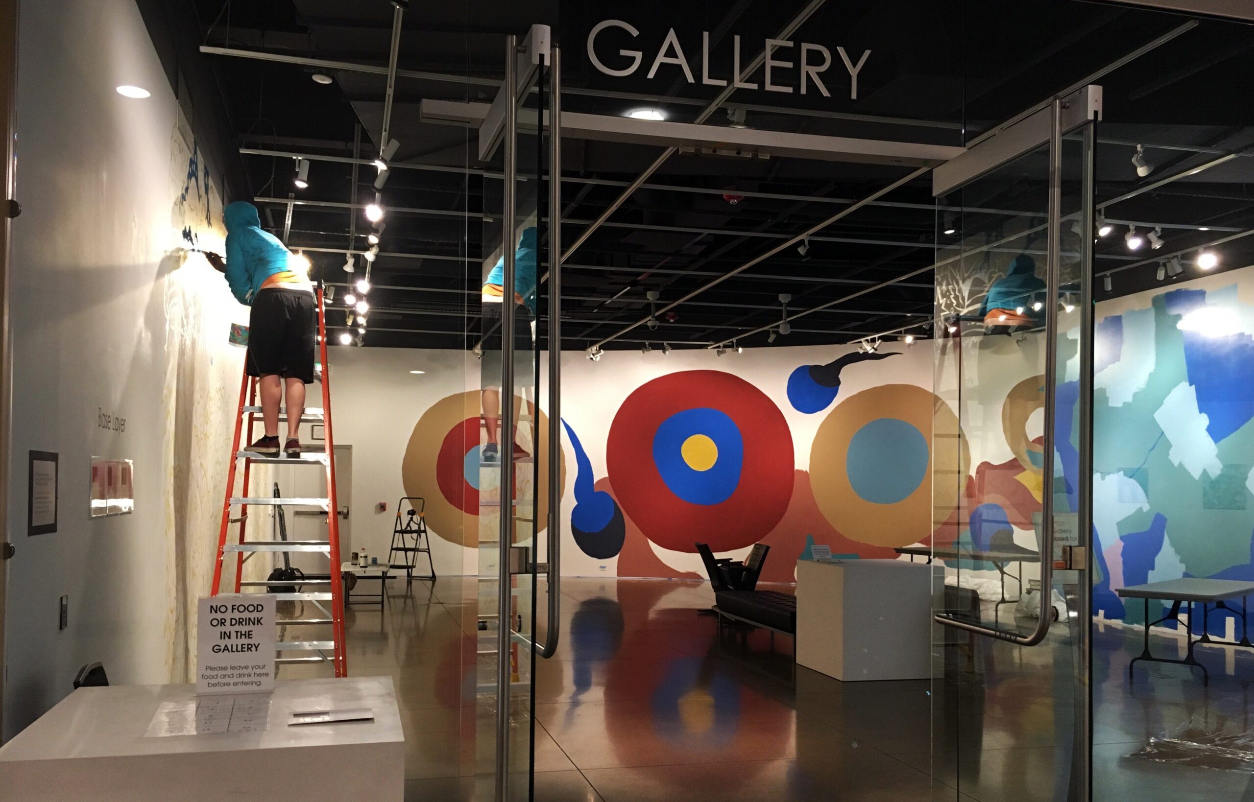 A later stage with more colors for the mural exhibit in The Lincoln Center Art Gallery. Mike McPuff is on the left painting.