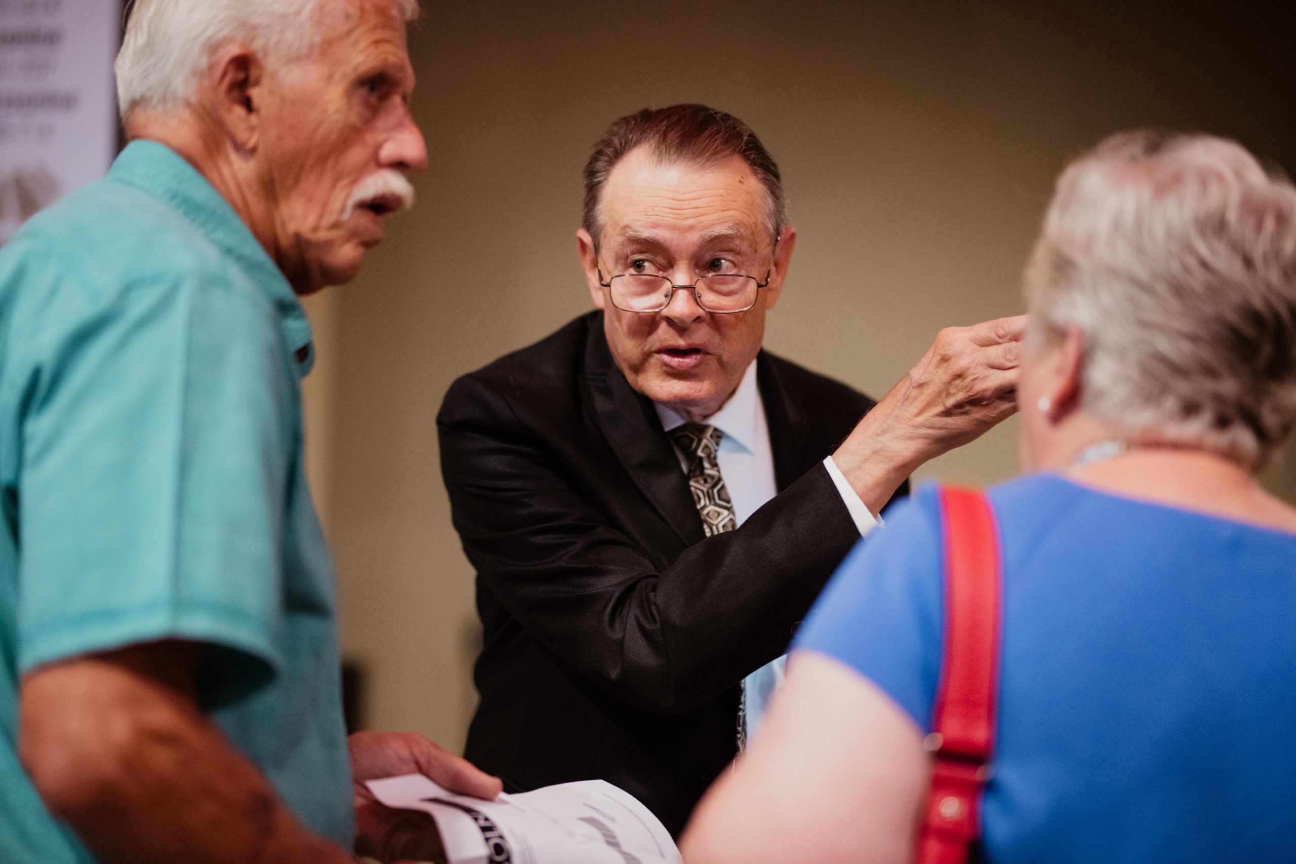 A volunteer giving directions to guests.