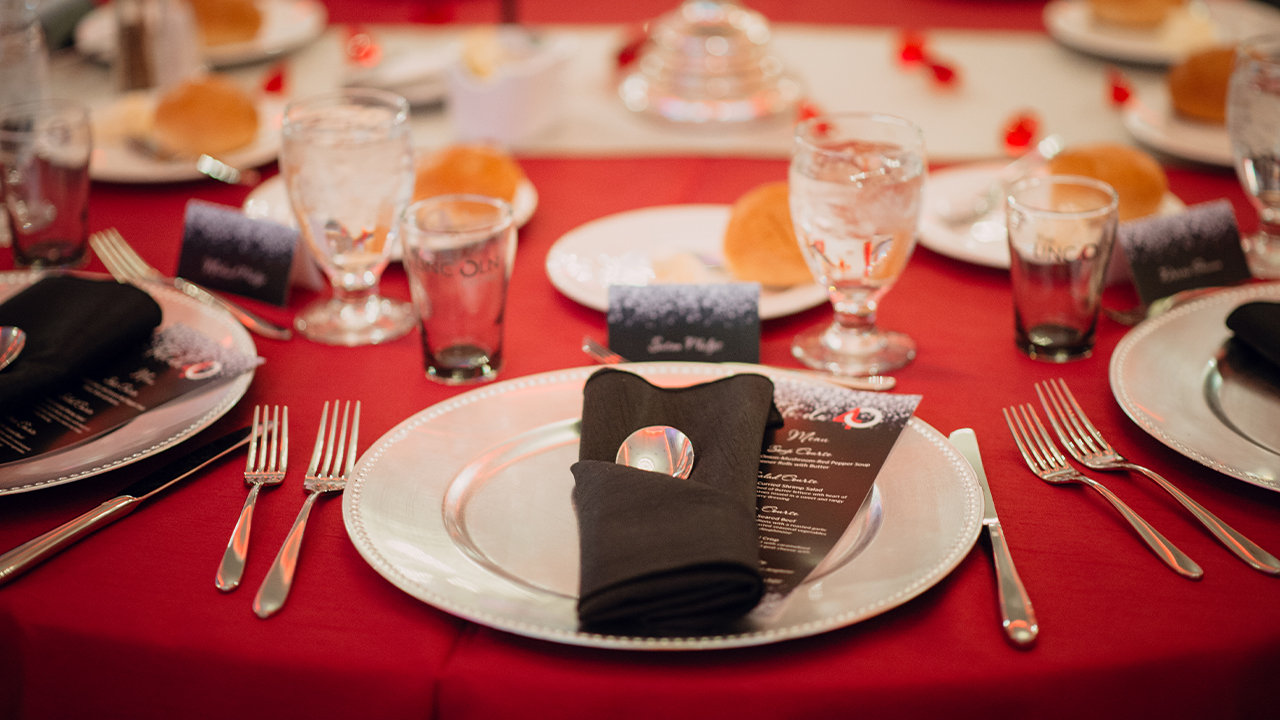 A tablet set with silver plates and ruby accents.