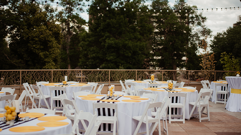 Tables set for outdoor reception on the Rooftop Deck.