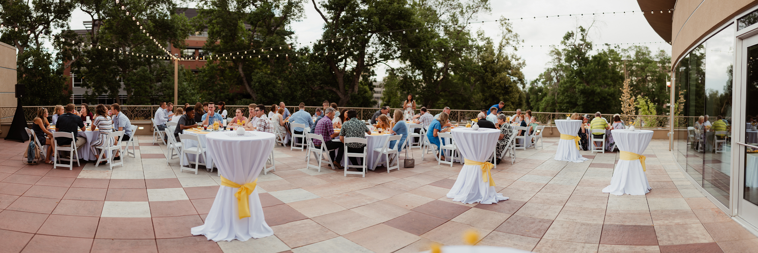 Guests enjoy themselves at a wedding reception on the Rooftop Deck.