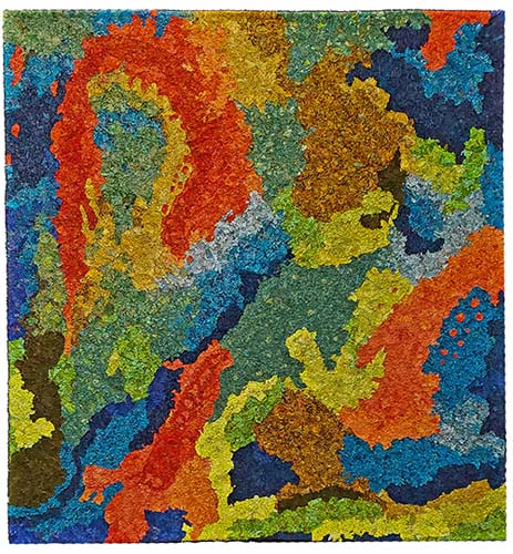 an abstract quilt with small pieces of multicolor fabric making up a larger organic design