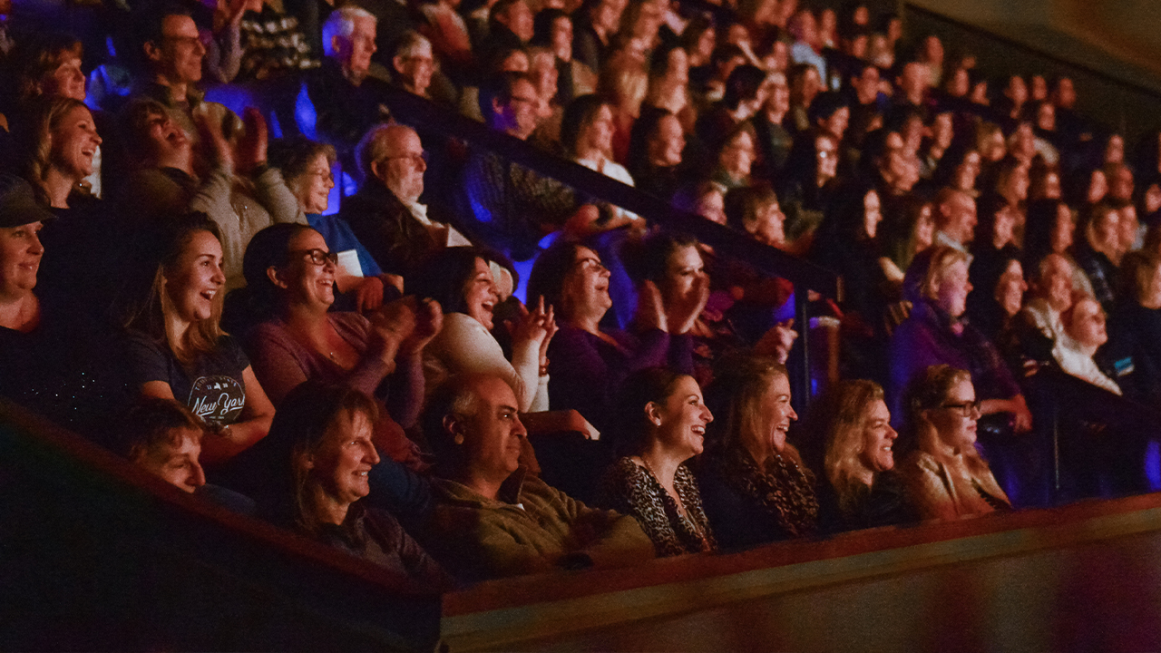 Audience laughing in Performance Hall.