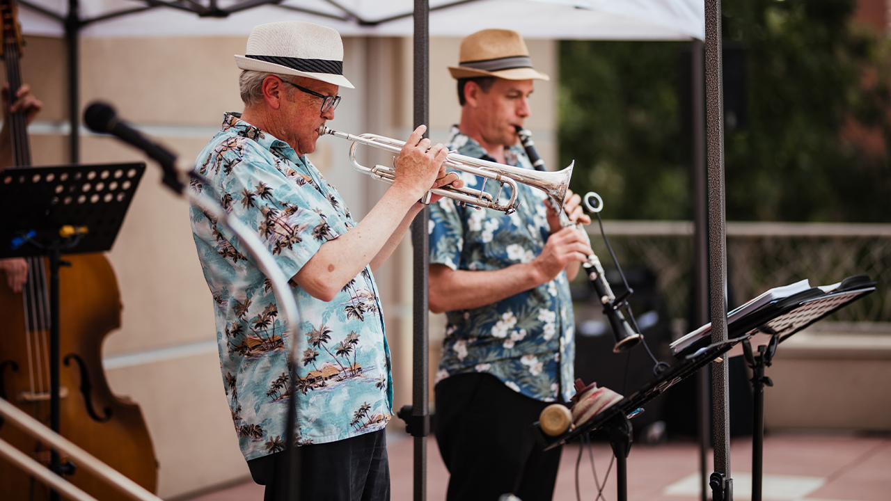 Band performs live on Rooftop Deck.