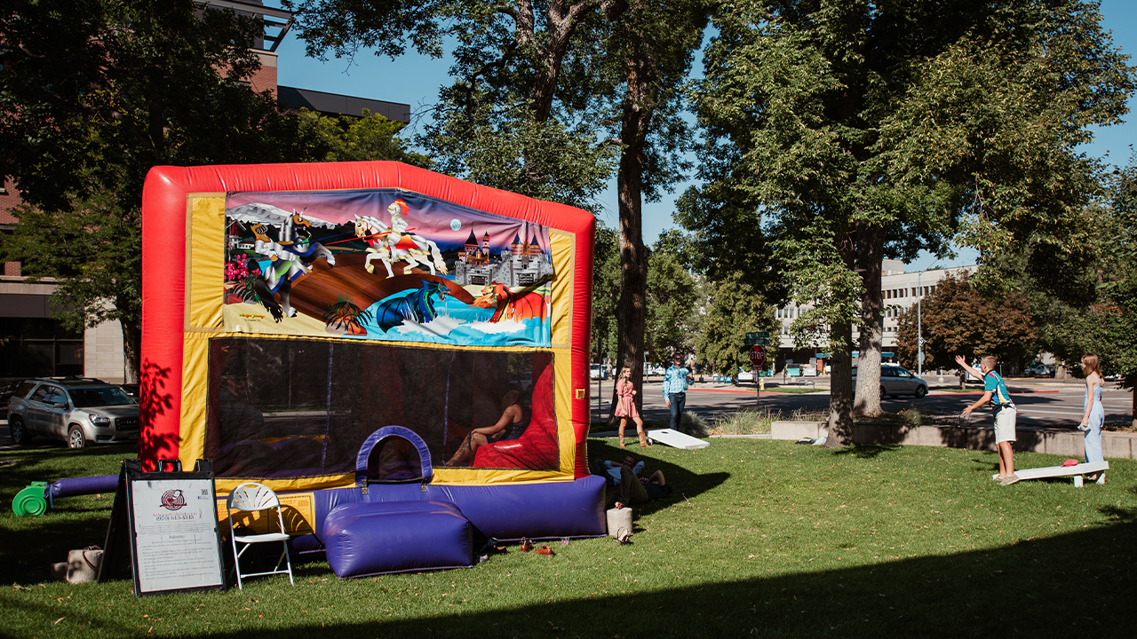 Bounce house on lawn games in front of The Lincoln Center.