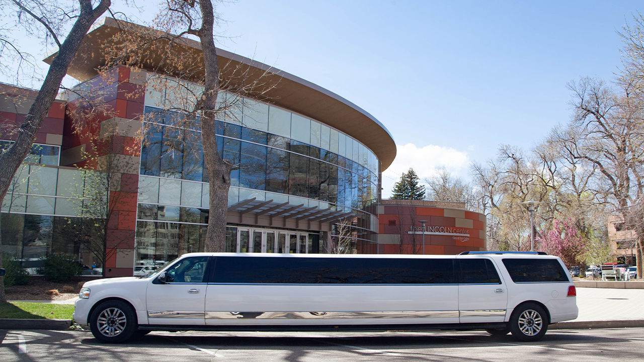 White limo parked in front of The Lincoln Center.