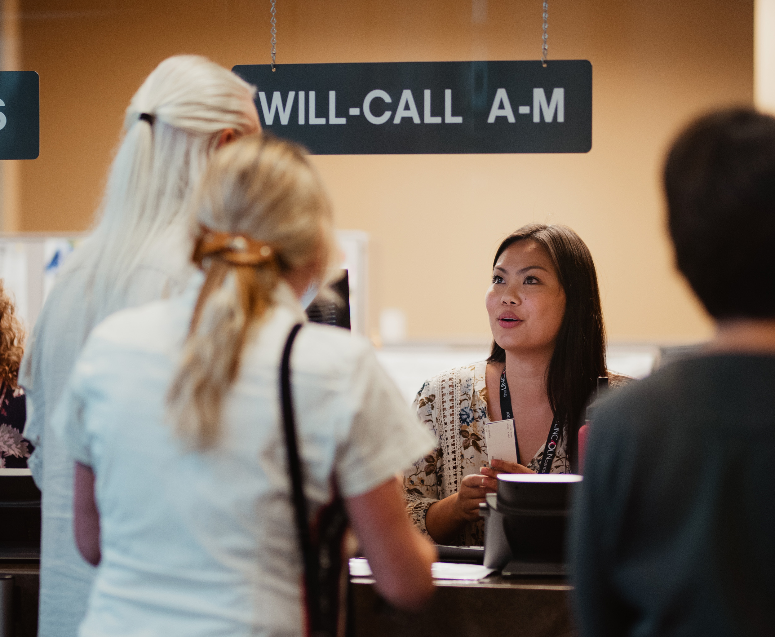 A Box Office Associate helping patrons at Will Call.