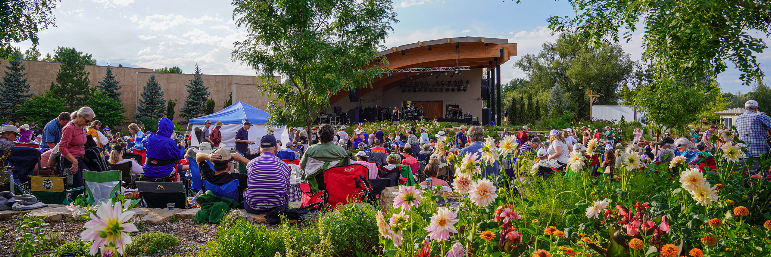 A concert going on in a beautiful garden setting.