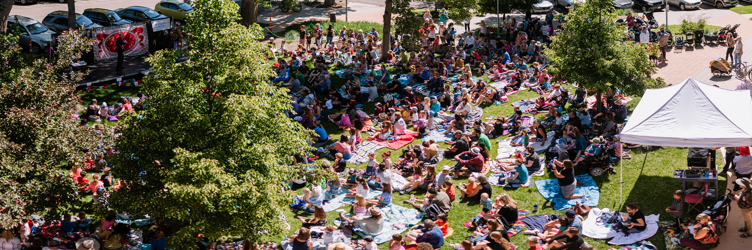 The Lincoln Center lawn full of people enjoying Salida Circus