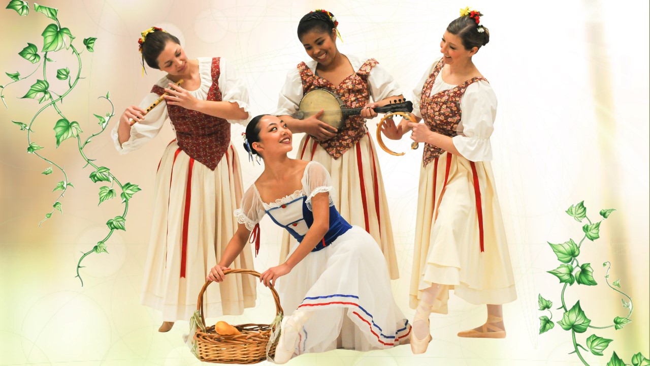 Four women dressed in peasant dresses