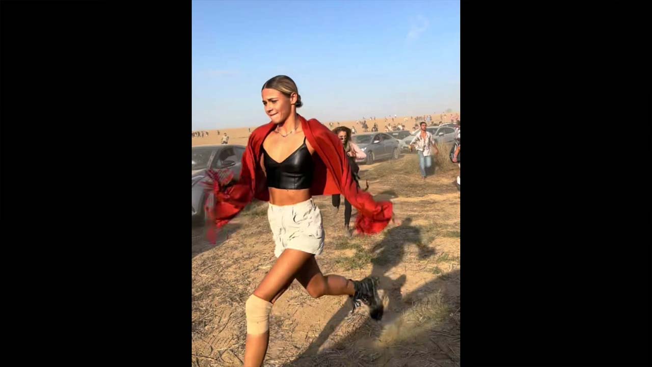 A scared girl running with a red scarf