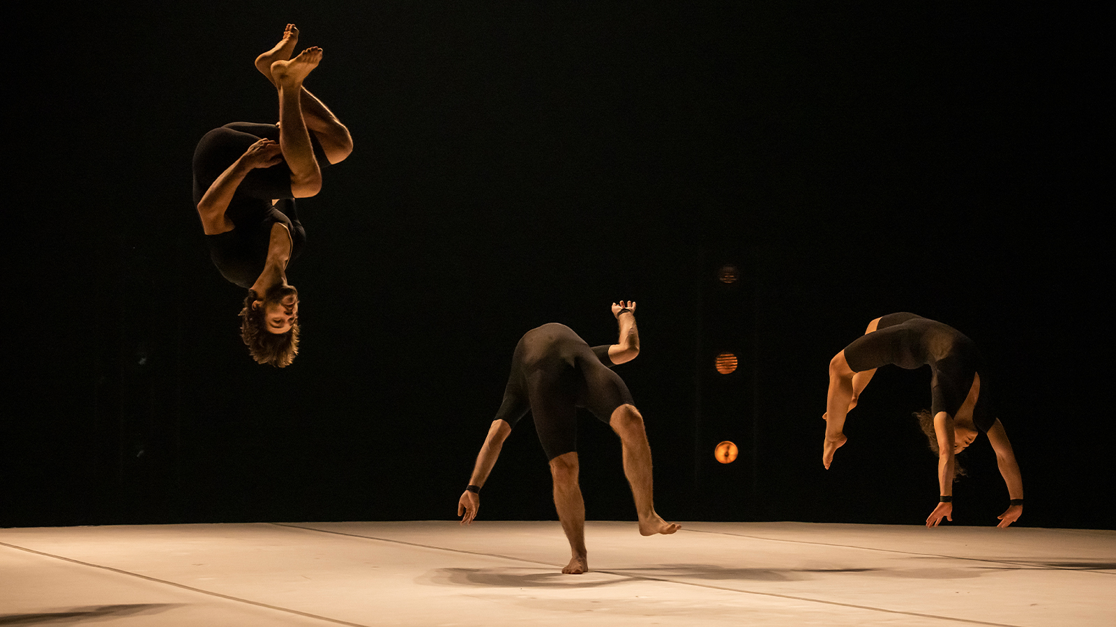 Members of Humans 2.0 doing various acrobatic stunts