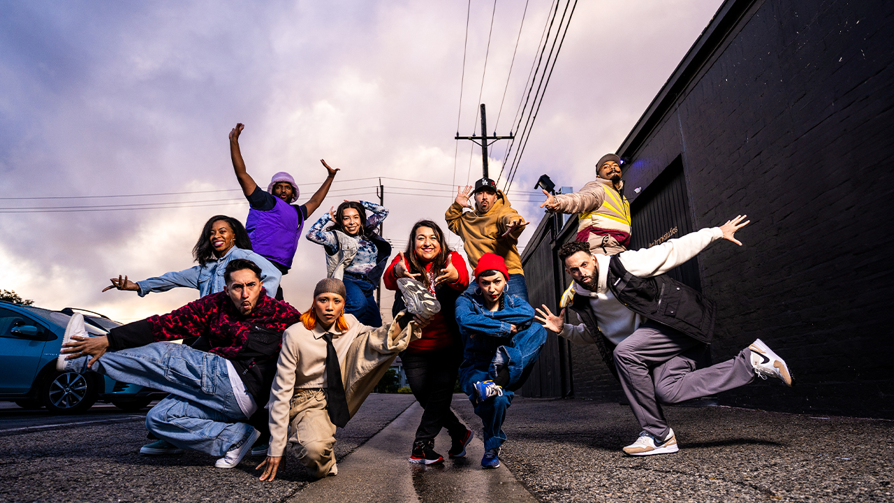 The dance group Versa-Style dynamically poses for a group picture