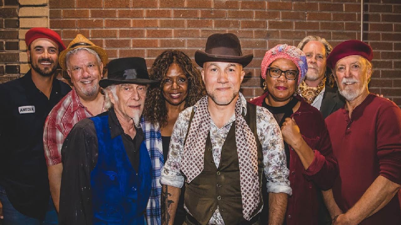 Eight band members smiling