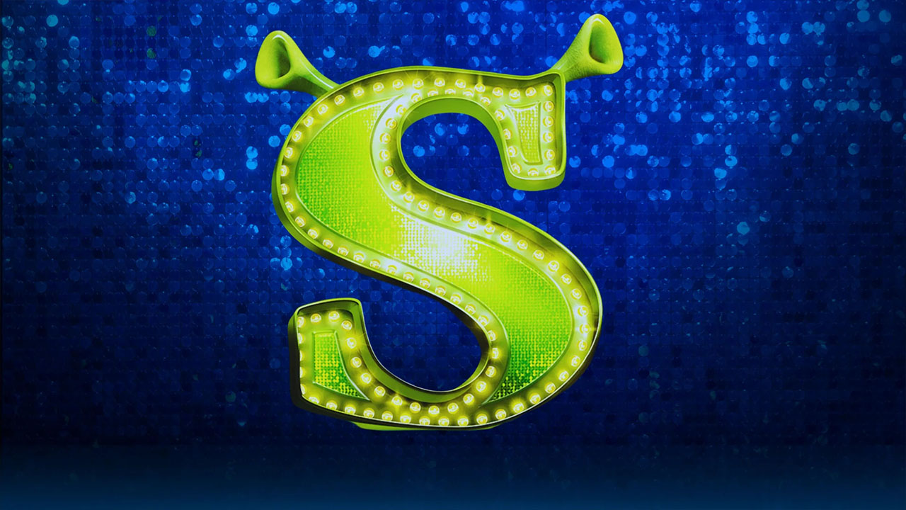 Blue background with large neon green "S" in middle with ogre ears on the top.