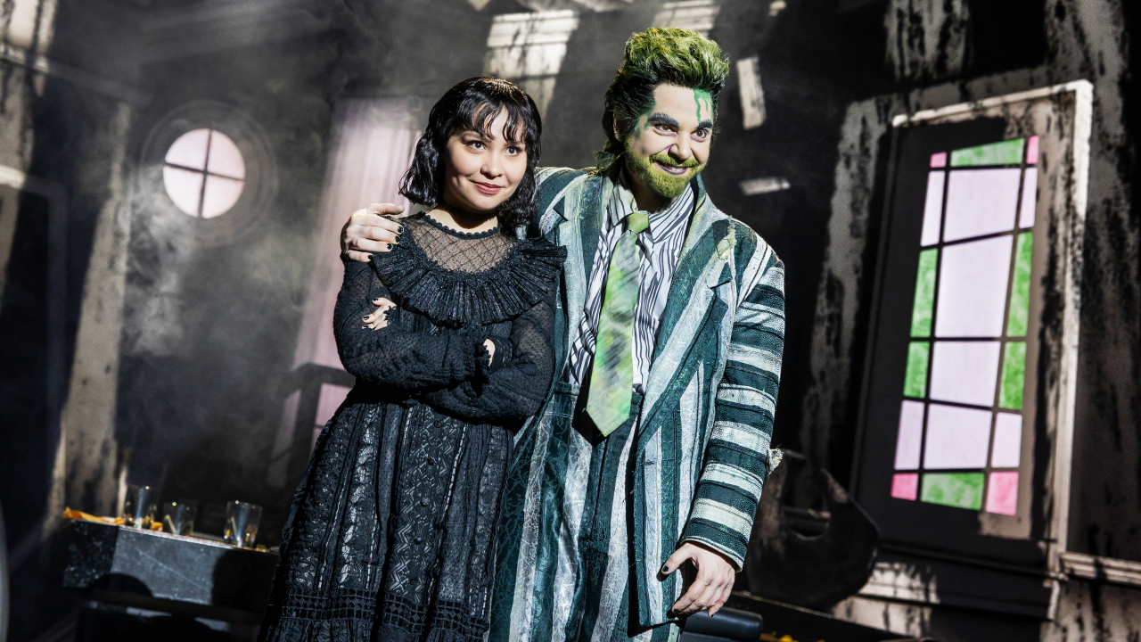 Beetlejuice with his arm around Lydia