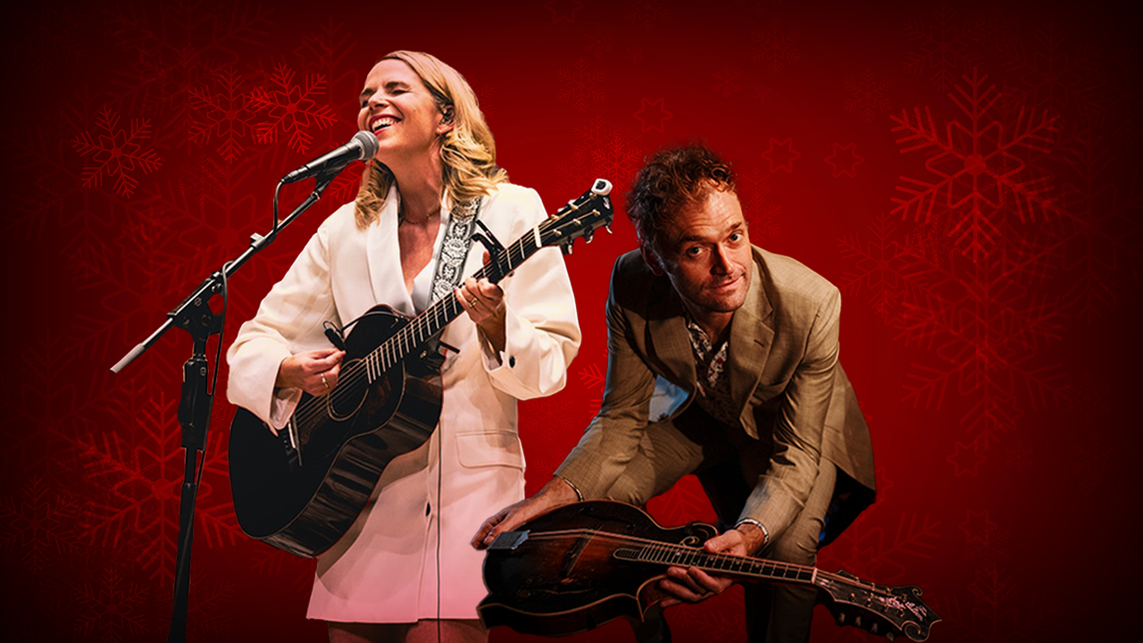 Musicians Aoife O'Donovan and Chris Thile in front of a red holiday background