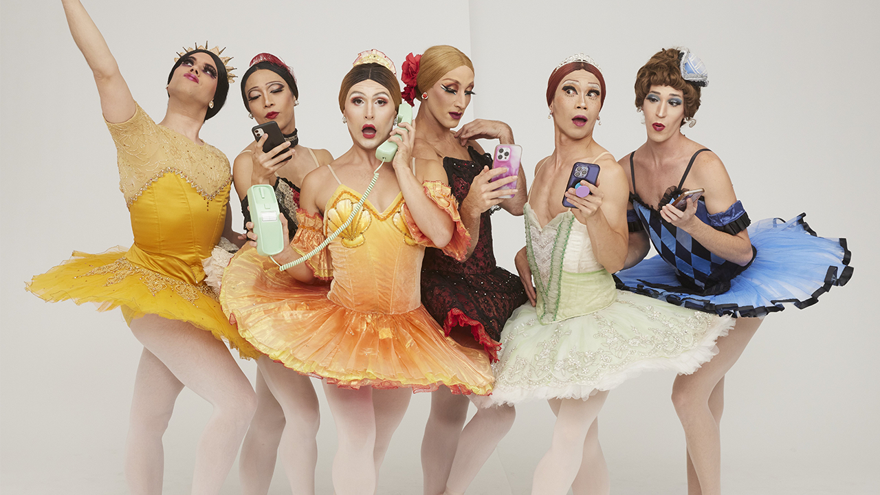 Members "The Trocks" pose for a photo in their full ballet dancer drag